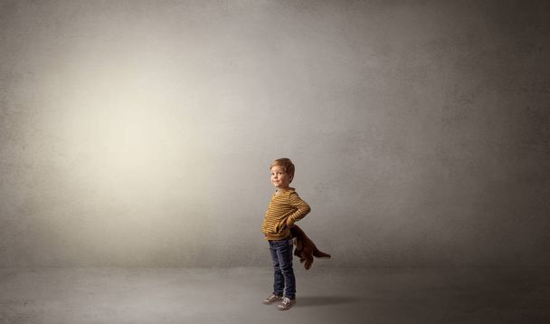 Little waggish kid in an empty room - Photo, Image