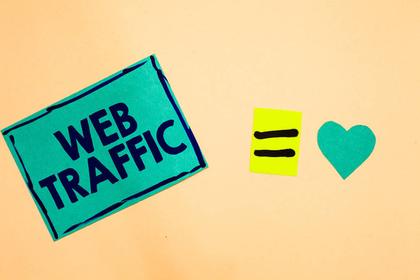 Text sign showing Web Traffic. Conceptual photo Amount of data sent and received by visitors to a website Turquoise piece paper reminder equal sign heart sending romantic feelings - Photo, Image