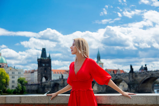 Beautiful girl in red dress travel in Prague - Foto, Imagem