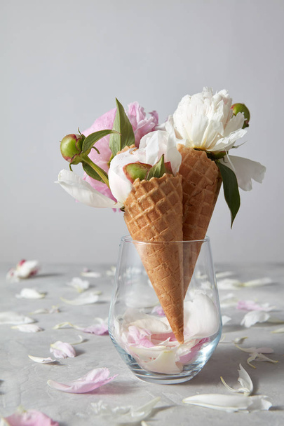 glass vase with white and pink peonies in waffle cones  - Photo, image