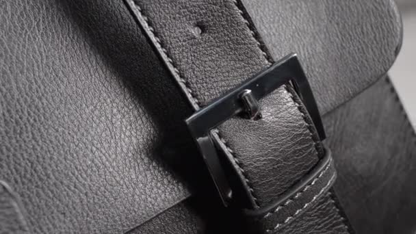 Detail from a female handbag. Black natural or artificial leather. - Footage, Video