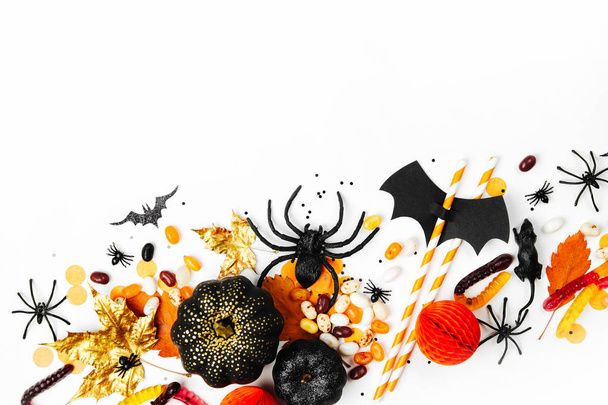 Halloween holiday background with candies, bats, spiders, pumpkins and decorations - Foto, afbeelding