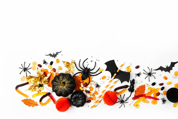 Halloween holiday background with candies, bats, spiders, pumpkins and decorations - Foto, immagini
