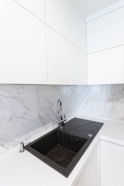 Modern minimalist sink in a kitchen room - Zdjęcie, obraz