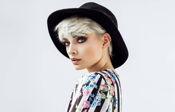 Beauty portrait of fashion blond model in a hat  - Фото, зображення