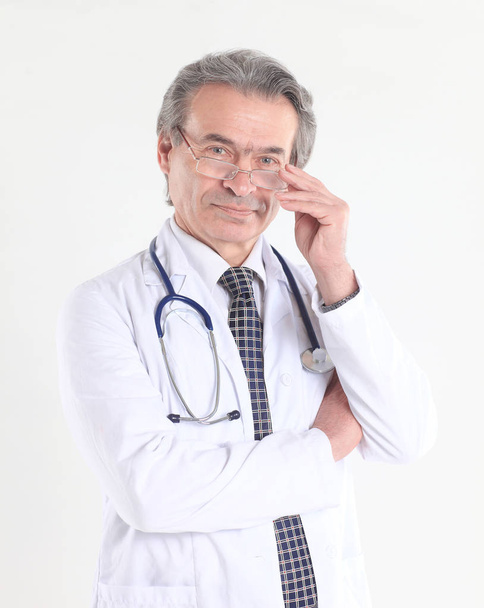 portrait of a confident physician with stethoscope .isolated on white background - Φωτογραφία, εικόνα