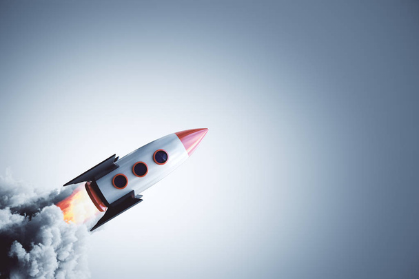 Launching rocket on gray background. Startup and entrepreneurship concept. 3D Rendering  - Фото, изображение