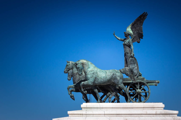 Bronze statue of Winged Victory on the top of King Vittorio Emanuele II, Rome, Italy - Photo, Image