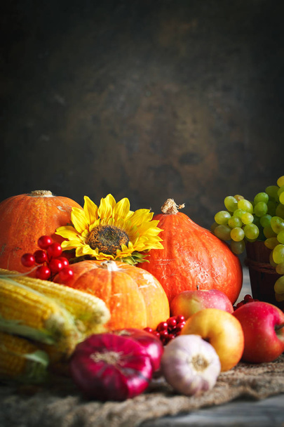 Happy Thanksgiving Day background, wooden table decorated with Pumpkins, Maize, fruits and autumn leaves. Harvest festival. Selective focus. Horizontal. Background with copy space. - Foto, immagini