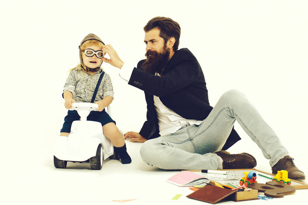 small boy driver or pilot and bearded father - Foto, Imagen