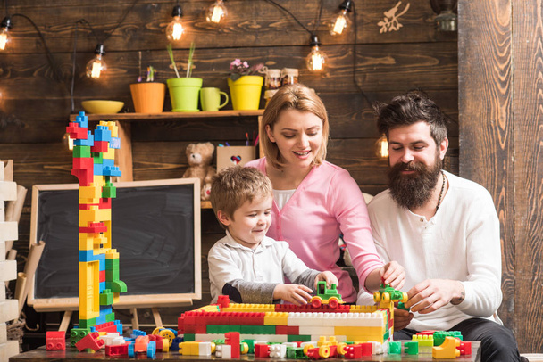 Family concept. Family build structure with toy bricks. Family play with colorful bricks. Family love and trust - Foto, immagini