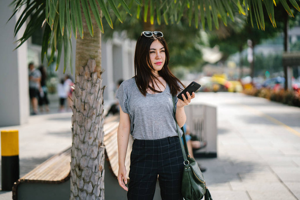 attractive young asian woman using smartphone  - Foto, Imagen