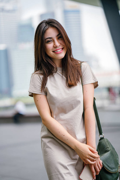 Happy attractive young asian woman walking on the street  - Foto, immagini