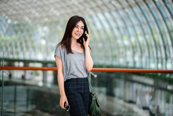 attractive young asian woman talking smartphone  - Photo, image