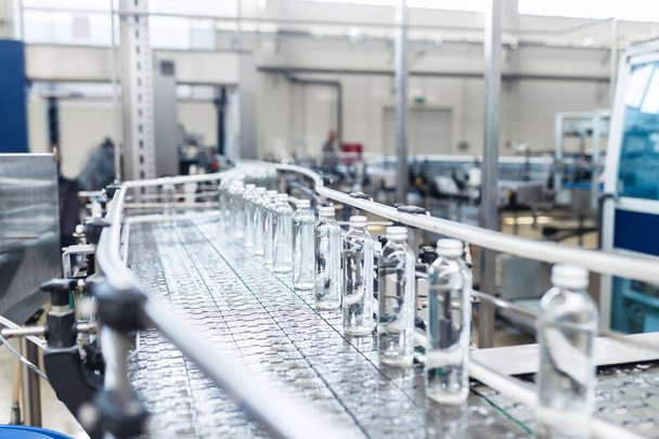 Bottling plant - Water bottling processing . Selective focus.  - Photo, Image