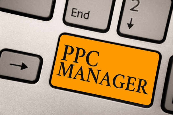 Handwriting text Ppc Manager. Concept meaning which advertisers pay fee each time one of their ads is clicked Keyboard orange key Intention create computer computing reflection document - Photo, Image