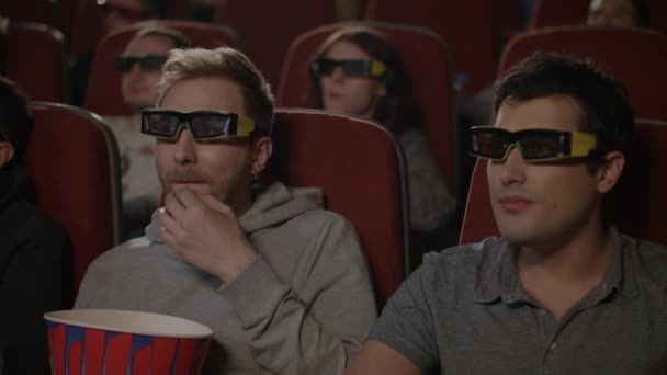 Friends watching 3d movie in cinema. 3d cinema entertainment concep - Footage, Video