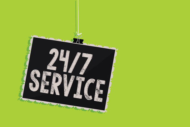 Conceptual hand writing showing 24 7 Service. Business photo text Always available to serve Runs constantly without disruption Hanging blackboard message communication sign green background - Photo, Image