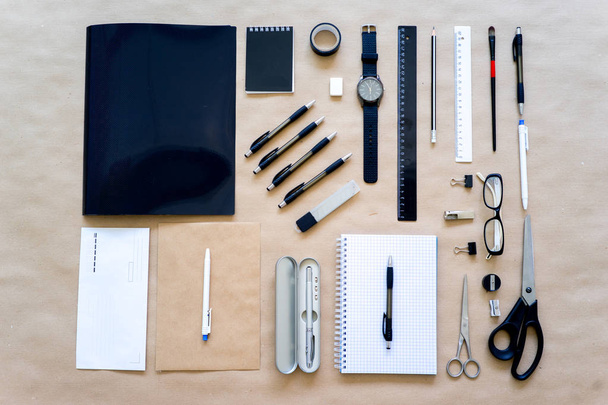 stationery pen scissors notebook on a wooden table - Φωτογραφία, εικόνα