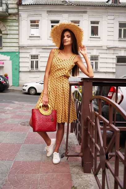 stylish female fashion model posing on the street  - Фото, зображення