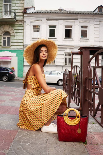 stylish female fashion model posing on the street  - Photo, Image