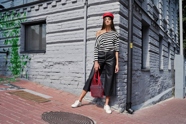 stylish female fashion model posing on the street  - Foto, imagen