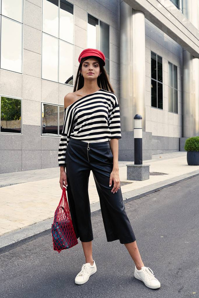 stylish female fashion model posing on the street  - Zdjęcie, obraz