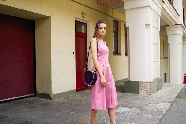 stylish female fashion model posing on the street  - Foto, imagen