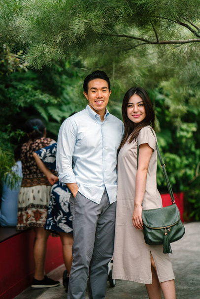 Portrait of young happy asian couple posing  - Fotó, kép