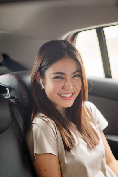 Beautiful young asian woman  in  car smiling - Fotó, kép