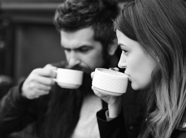 Couple in love drinks espresso during coffee break. - Foto, afbeelding