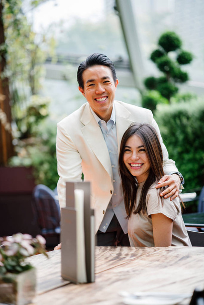 Happy young romantic asian couple in cafe   - Fotografie, Obrázek