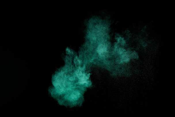 Aquamarine powder explosion on black background. Colored powder cloud. Colorful dust explode. Paint  Holi. - Foto, imagen