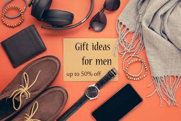 Flat lay of male accessories on orange background - Foto, Imagem