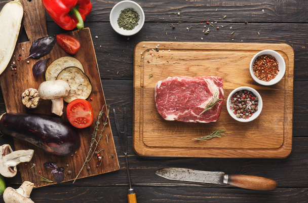 Raw filet mignon steak on wooden board - Photo, image
