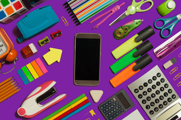 office supplies surrounding a mobile phone - Foto, immagini