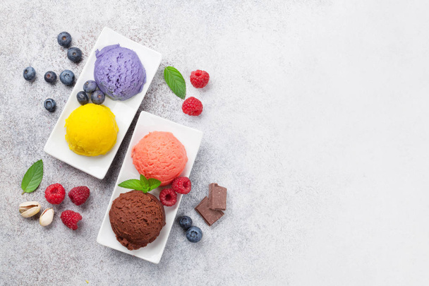 Ice cream with nuts and berries. Top view with space for your text - Фото, зображення