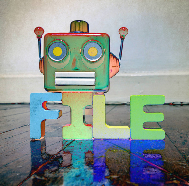 red retro robot head on the word FILE  on old wooden floor - Photo, Image