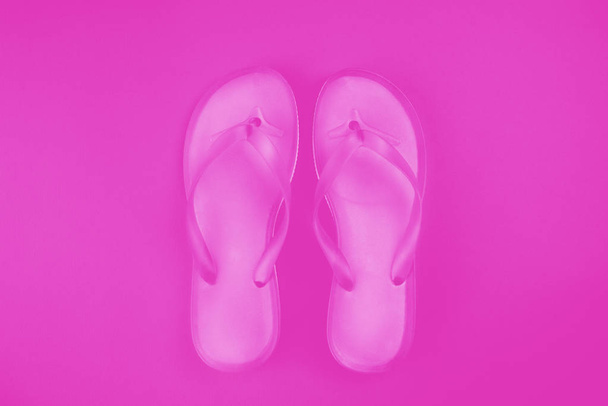 Stylish pink flip flop sandals, top view with copy space over yellow background - Фото, зображення
