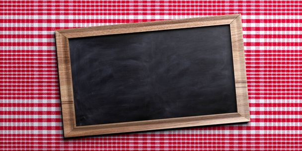 Blank chalkboard on red checkered picnic tablecloth, space for text. 3d illustration - Photo, Image