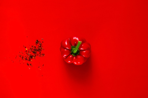 Spices and Creative red pepper  on red background.Frame of organic food. The concept of vegetarian food and healthy diet, copy space, closeup,banner. - Valokuva, kuva