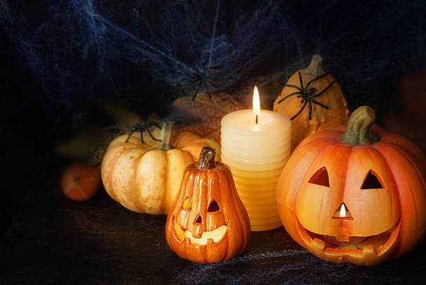 Halloween pumpkin decor with candle and spiders - Fotografie, Obrázek