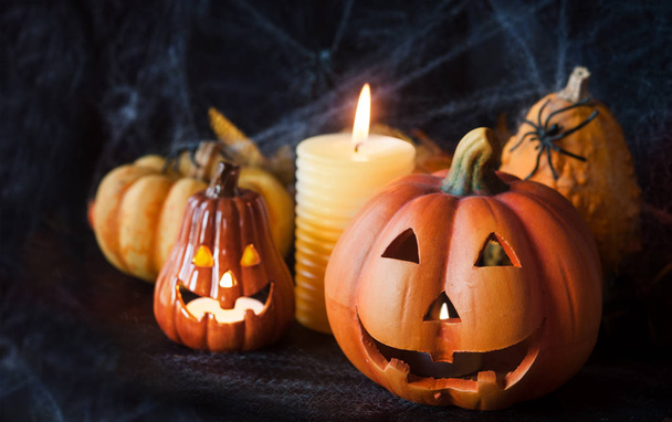 Halloween pumpkin decor with candle and spiders - Photo, Image
