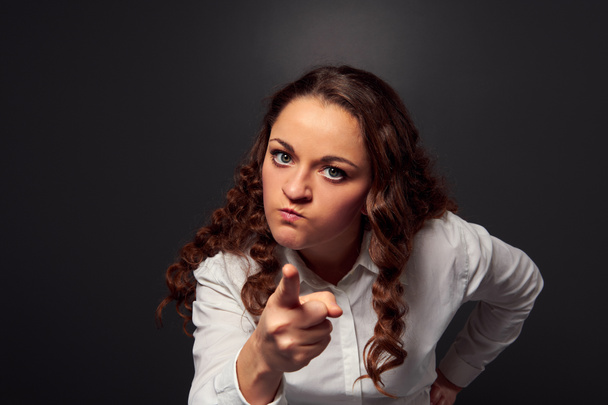 studio shot of angry woman pointing at camera - Photo, Image