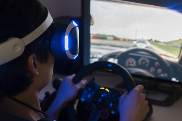 Playing racing video game with VR headset at home - Foto, Imagem
