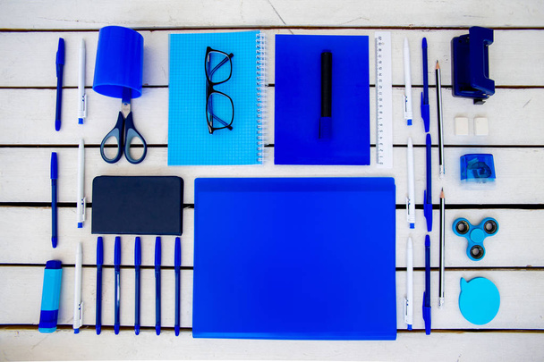 stationery pen scissors notebook on a wooden table - Φωτογραφία, εικόνα