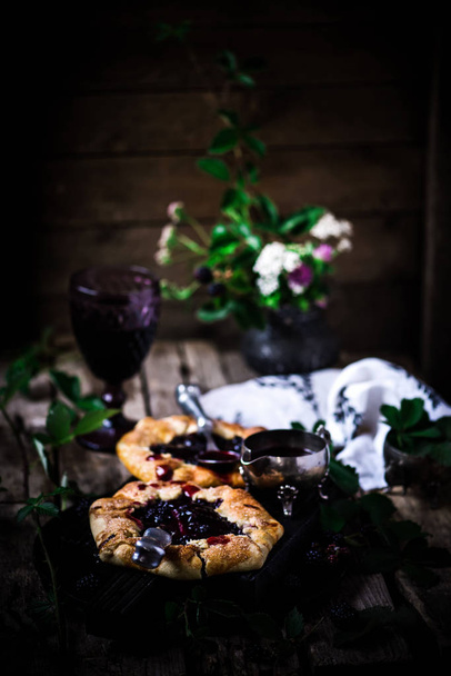 Blackberry Galette with Red Wine Sauce.style rustic. selective focus - Zdjęcie, obraz