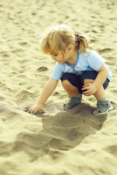 Cute baby boy play with sand - Valokuva, kuva