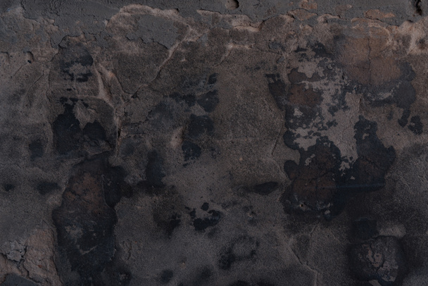 Vollbild-Ansicht der schwarzen rissigen Wand texturierten Hintergrund      - Foto, Bild