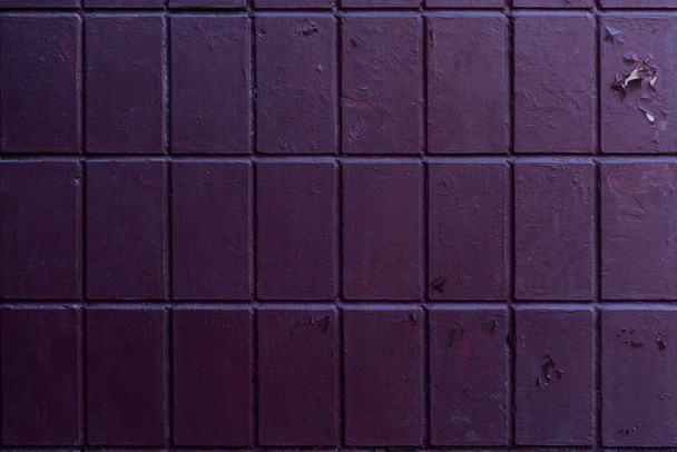 old weathered purple brick wall background  - Фото, изображение